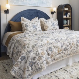 spacious bedroom with bookcases
