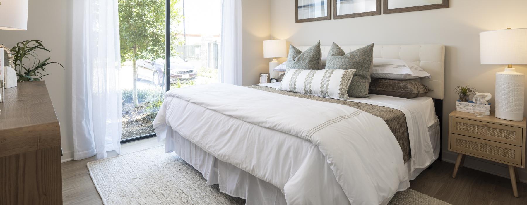 a bedroom with a large window
