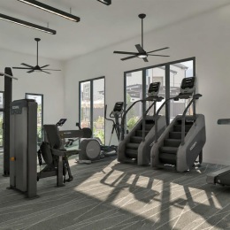 a room with exercise equipment and windows