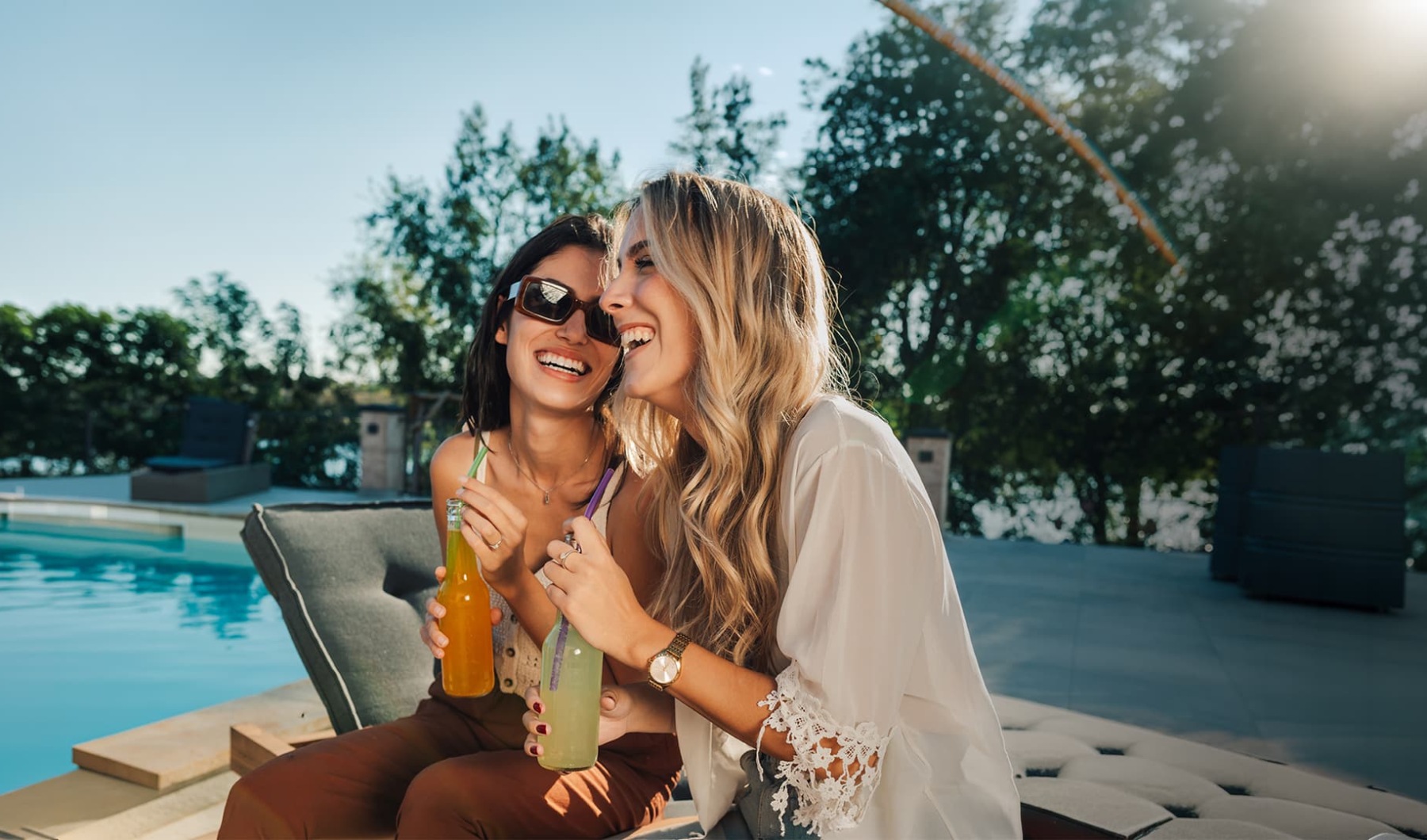 two women sitting on a bench